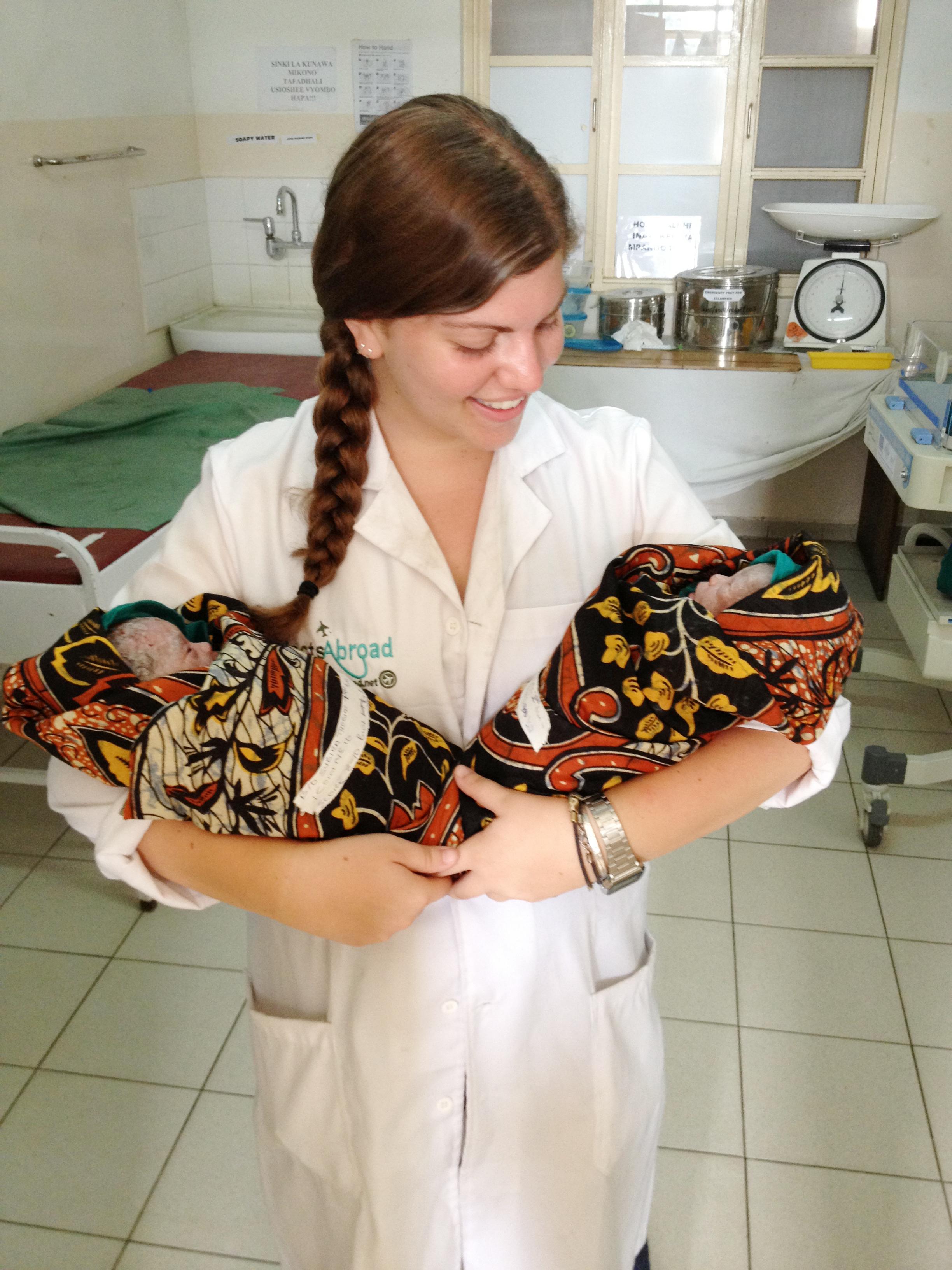 Projects Abroad intern holding newly born twins in the hospital during her midwifery internship in Tanzania. An intern photographed holding newly born twins whilst on her midwifery internship in Tanzania with Projects Abroad.